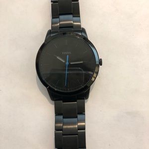 Men’s black Fossil watch.